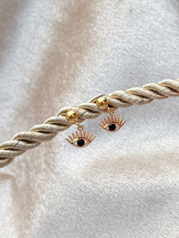 Boucles d'oreilles pendantes en acier inoxydable avec forme d'oeil avec un strass noir dans l’oeil